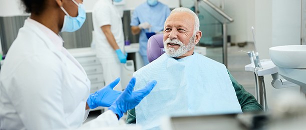 Dentist talking to senior patient about nitrous oxide