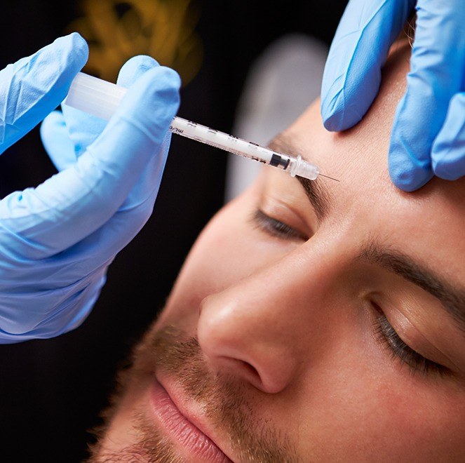 Man receiving Botox injections for TMJ therapy