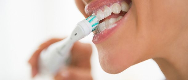 Woman brushing her teeth